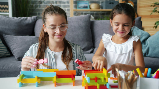 Mom and daughter playing with colorful blocks