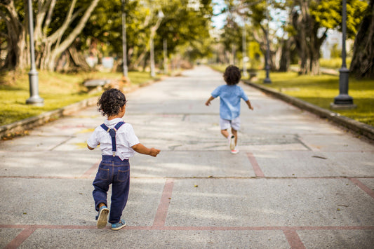 Children running down a concrete path