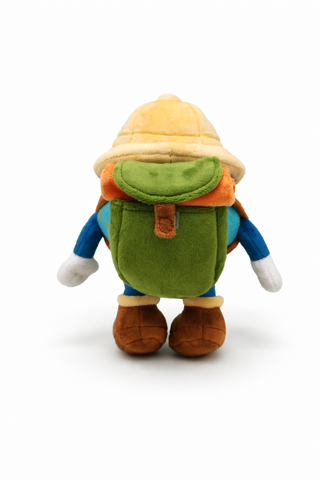 Plush toy of a character with a green backpack and yellow hat on a white background